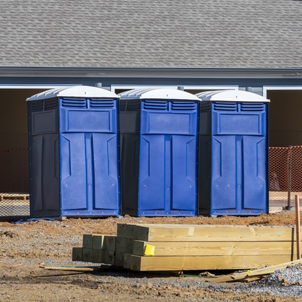 what is the cost difference between standard and deluxe portable toilet rentals in Roodhouse